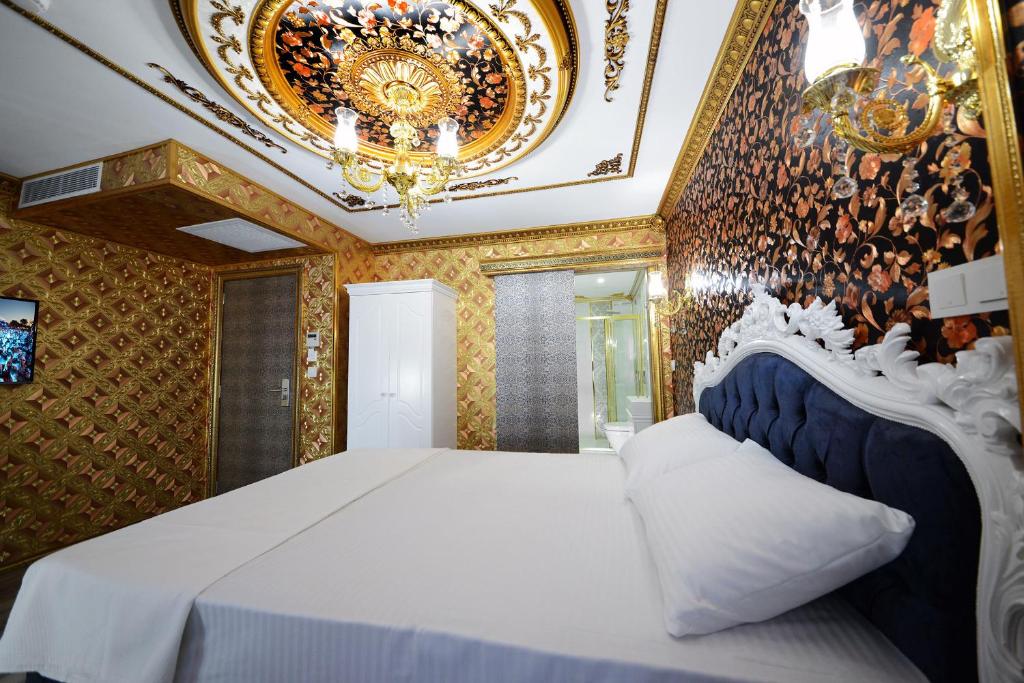 Postel nebo postele na pokoji v ubytování Fatih Babel Park Hotel