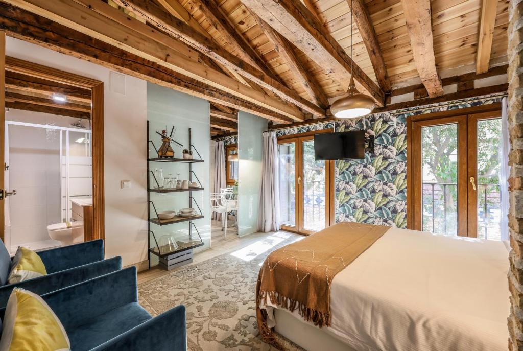 En eller flere senge i et værelse på Apartamento Plaza de España 7