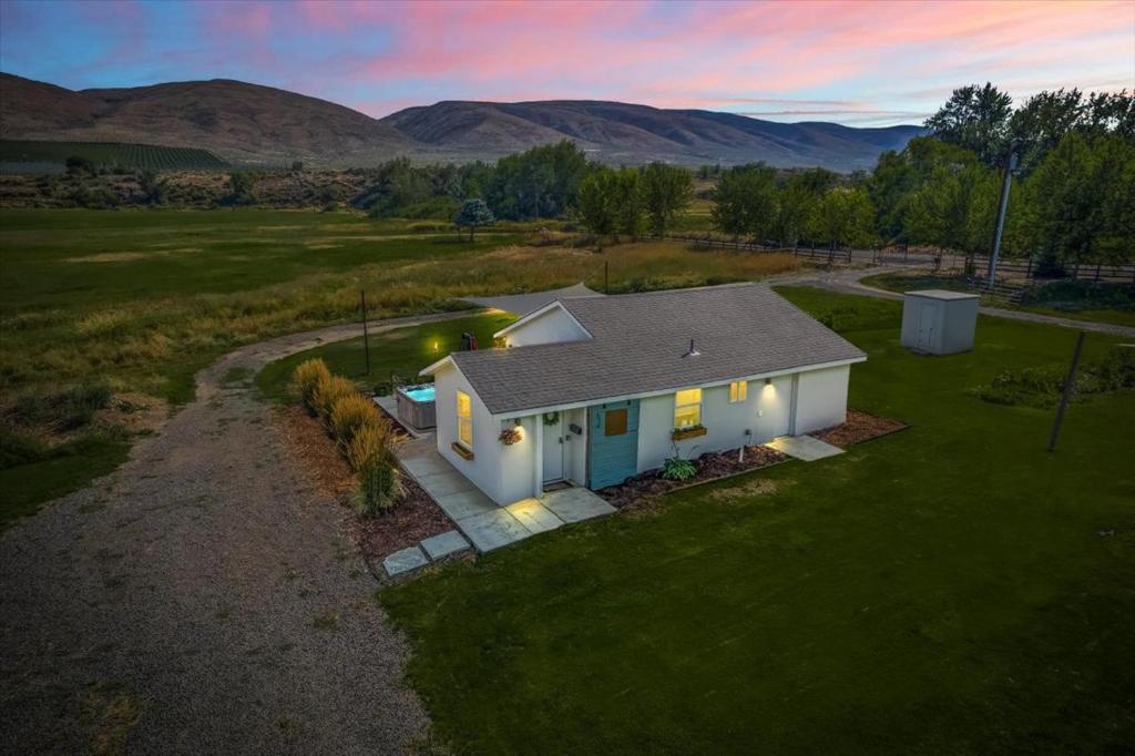 an overhead view of a white house in a field at The Ahtanum Cottage - NEW hot tub and great views! in Yakima