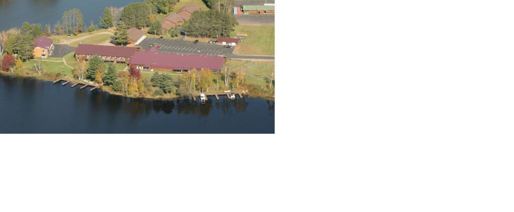 an aerial view of a house on a lake at Eagle River Inn and Resort in Eagle River