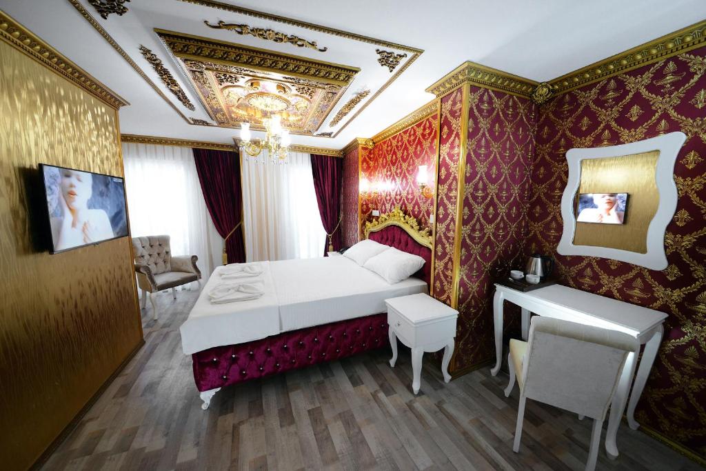 Postel nebo postele na pokoji v ubytování Fatih Babel Park Hotel
