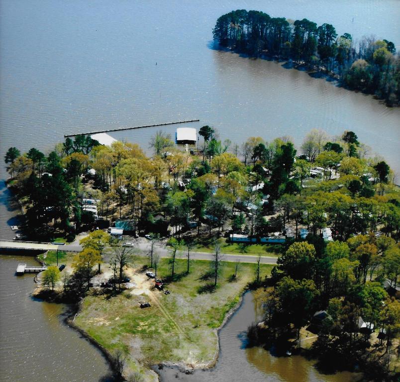 an aerial view of an island in the water at Holly Park Marina in Milam