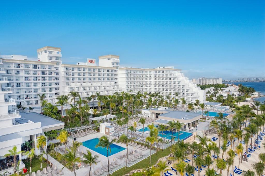 an aerial view of a resort with palm trees at Riu Caribe - All Inclusive in Cancún