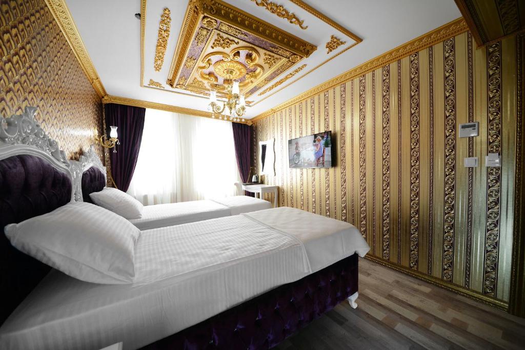 Postel nebo postele na pokoji v ubytování Fatih Babel Park Hotel