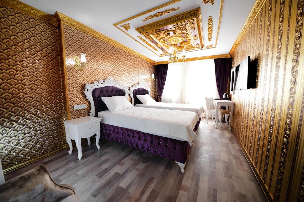 Postel nebo postele na pokoji v ubytování Fatih Babel Park Hotel