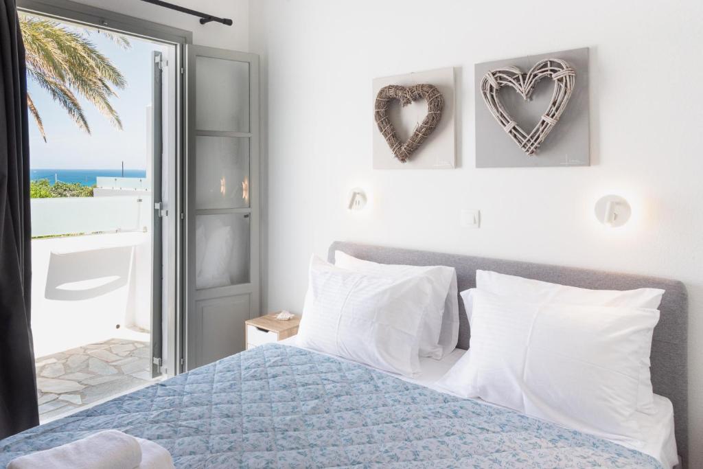 a bedroom with a bed with a view of the ocean at Navi B3 Brand New studio in Naousa in Naousa