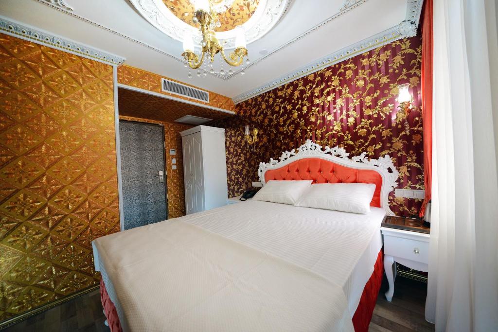 Postel nebo postele na pokoji v ubytování Fatih Babel Park Hotel