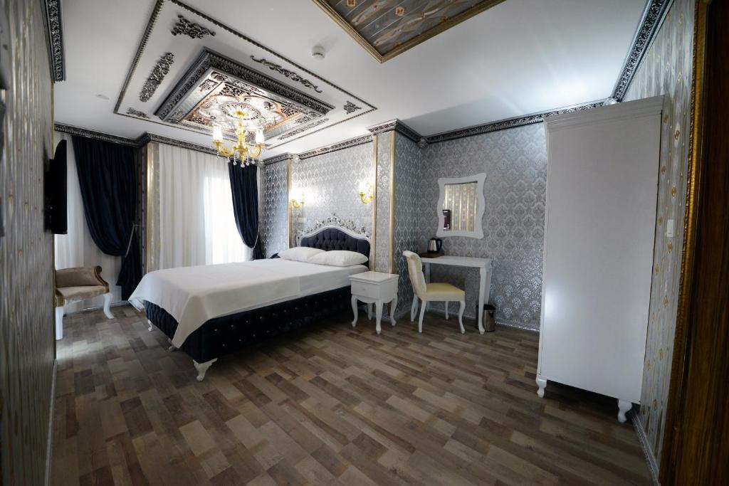 Postel nebo postele na pokoji v ubytování Fatih Babel Park Hotel