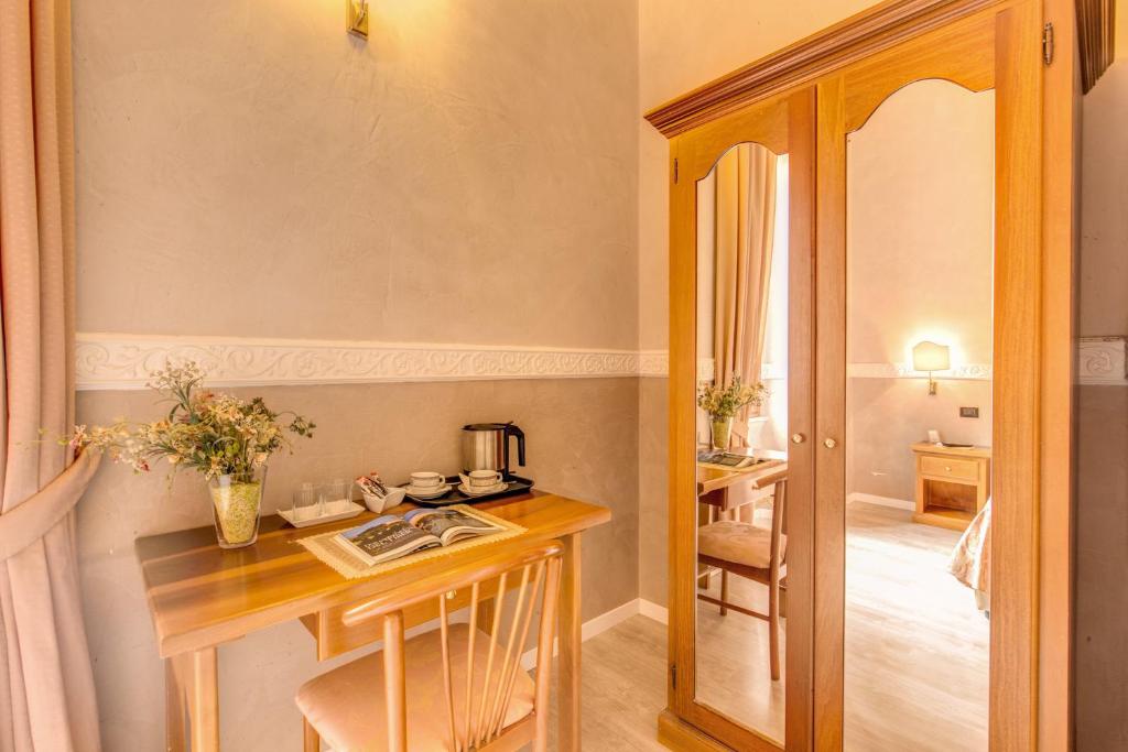 Postel nebo postele na pokoji v ubytování Hotel Martini