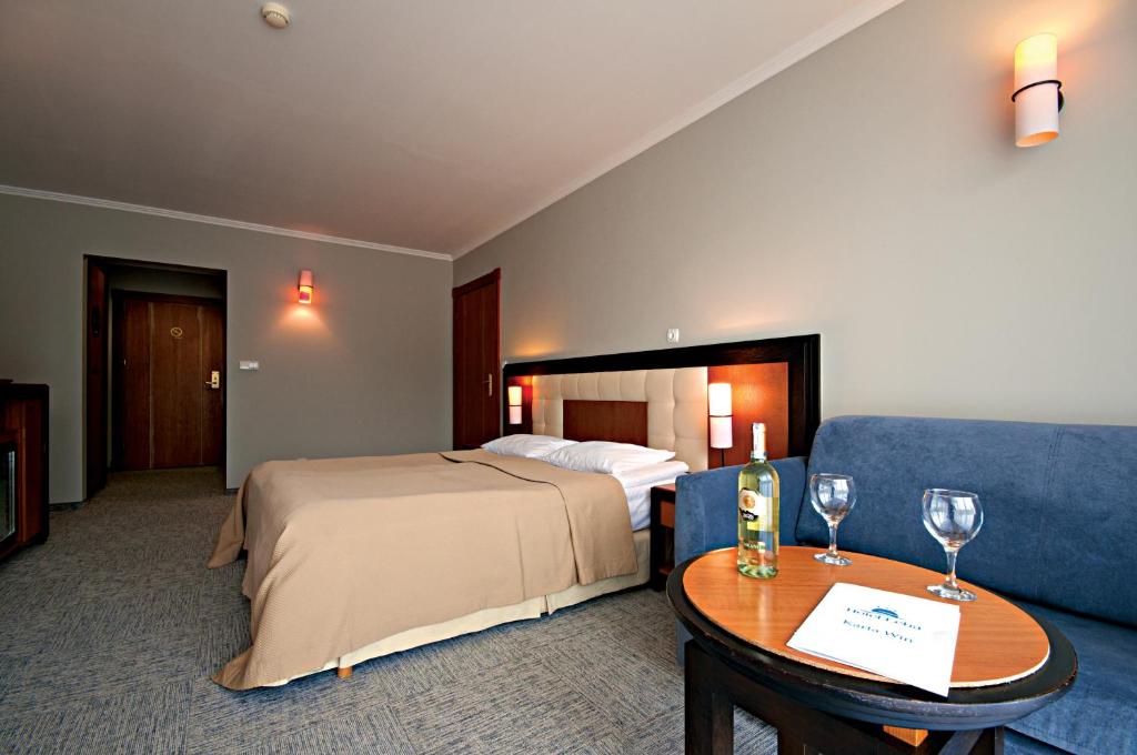 Postel nebo postele na pokoji v ubytování Łeba Hotel & Spa