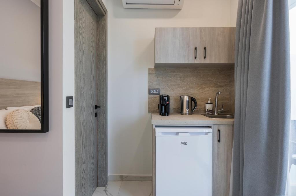 Kuchyň nebo kuchyňský kout v ubytování Alexia Seaview Apartments