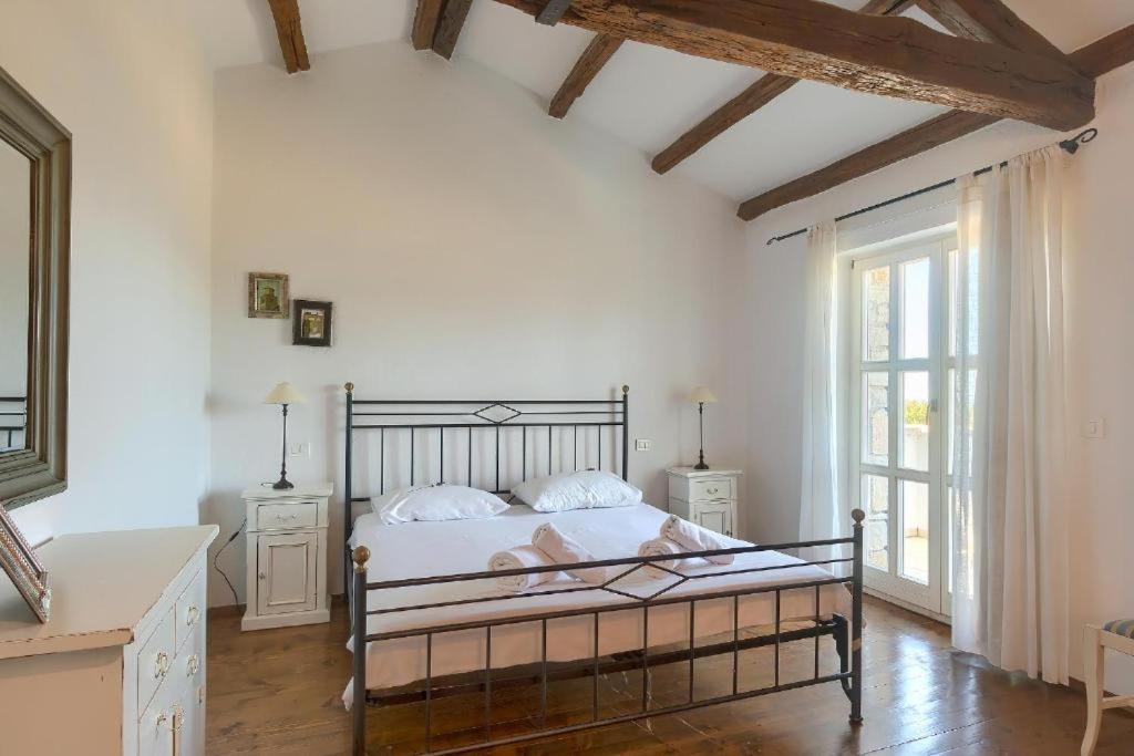 Postel nebo postele na pokoji v ubytování Villa Olivetta by Istrian Country Houses