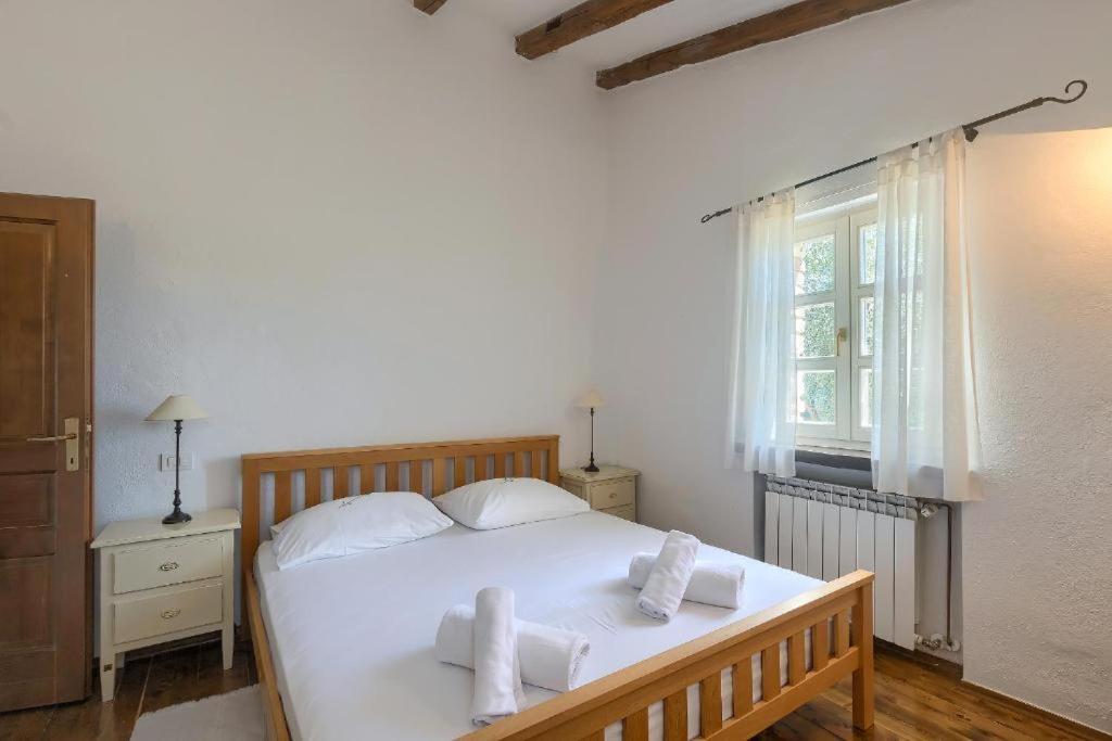 Postel nebo postele na pokoji v ubytování Villa Olivetta by Istrian Country Houses