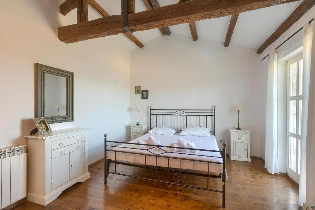 Postel nebo postele na pokoji v ubytování Villa Olivetta by Istrian Country Houses