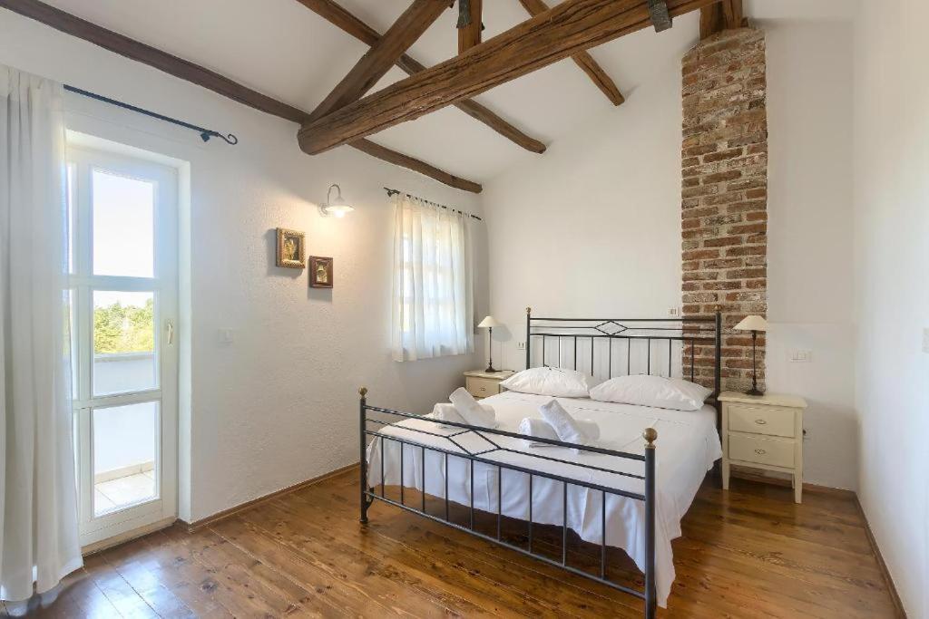 Postel nebo postele na pokoji v ubytování Villa Olivetta by Istrian Country Houses