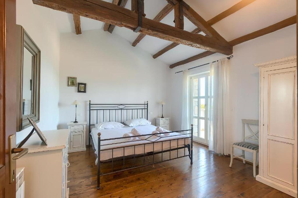 Postel nebo postele na pokoji v ubytování Villa Olivetta by Istrian Country Houses