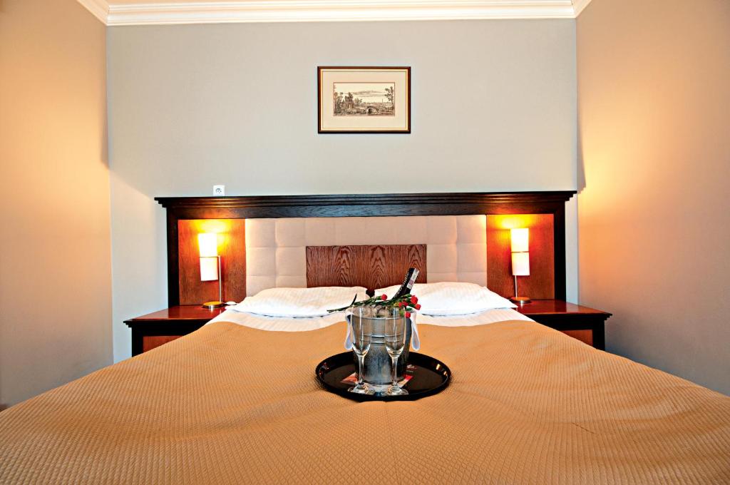 Postel nebo postele na pokoji v ubytování Łeba Hotel & Spa