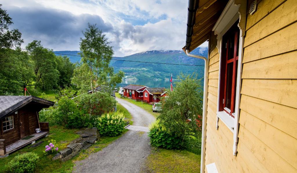 a view from a window of a house at Nesset Fjordcamping in Olden