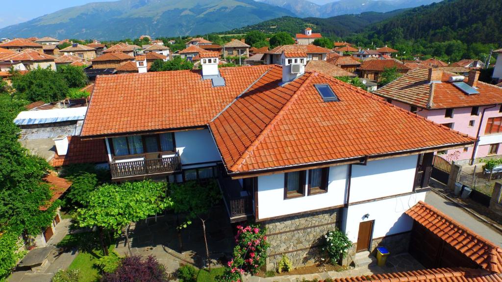 an aerial view of a village with red roofs at Guest House Stara Planina in Kalofer