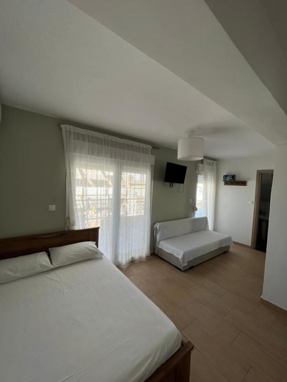 Postel nebo postele na pokoji v ubytování Happy Traveller SKG