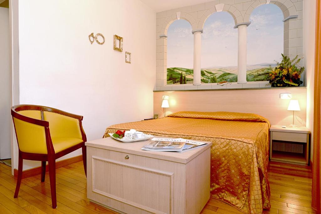 Postel nebo postele na pokoji v ubytování Hotel La Colonna