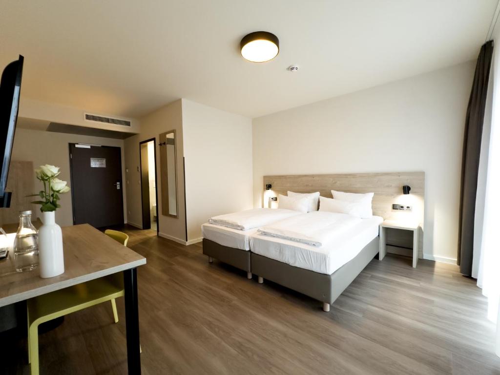 DiMas Hotel Ettenheim - Rustにあるベッド