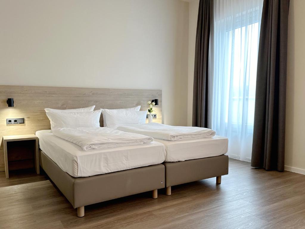 DiMas Hotel Ettenheim - Rustにあるベッド