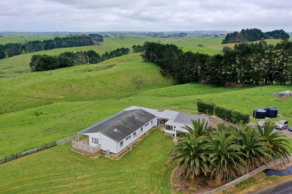 an aerial view of a house in a field at Apartment 1 in Auckland