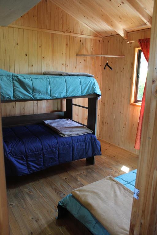 Postel nebo postele na pokoji v ubytování Acun Lihuen