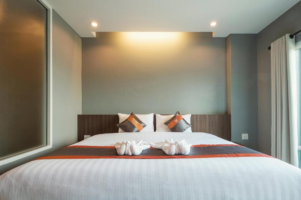 Postel nebo postele na pokoji v ubytování Hansanan Hotel