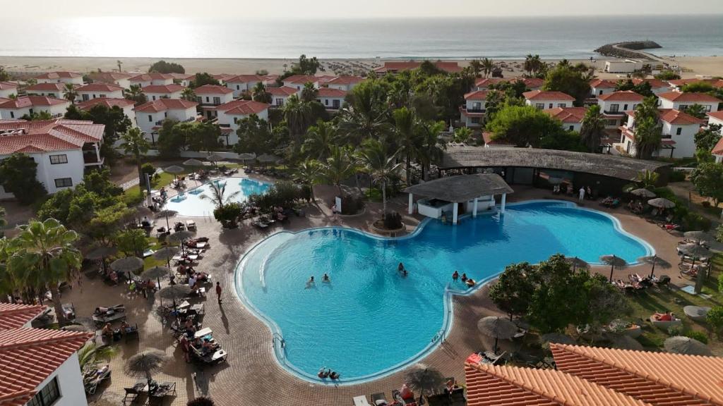 an overhead view of a swimming pool at a resort at Tortuga Beach Villa in Santa Maria