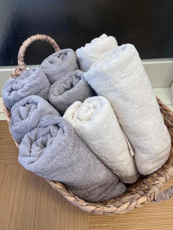 a basket filled with towels sitting on a table at 水龍Suiryu in Fujisawa