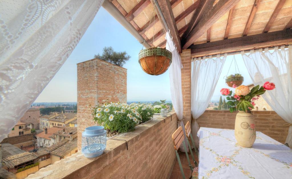 a balcony with a view of a city at Spello House Altana in Spello