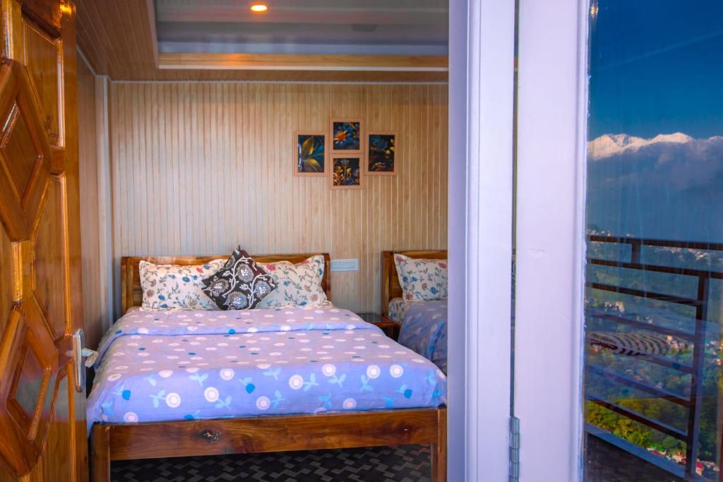 Postel nebo postele na pokoji v ubytování Rambler's Nesting Homestay