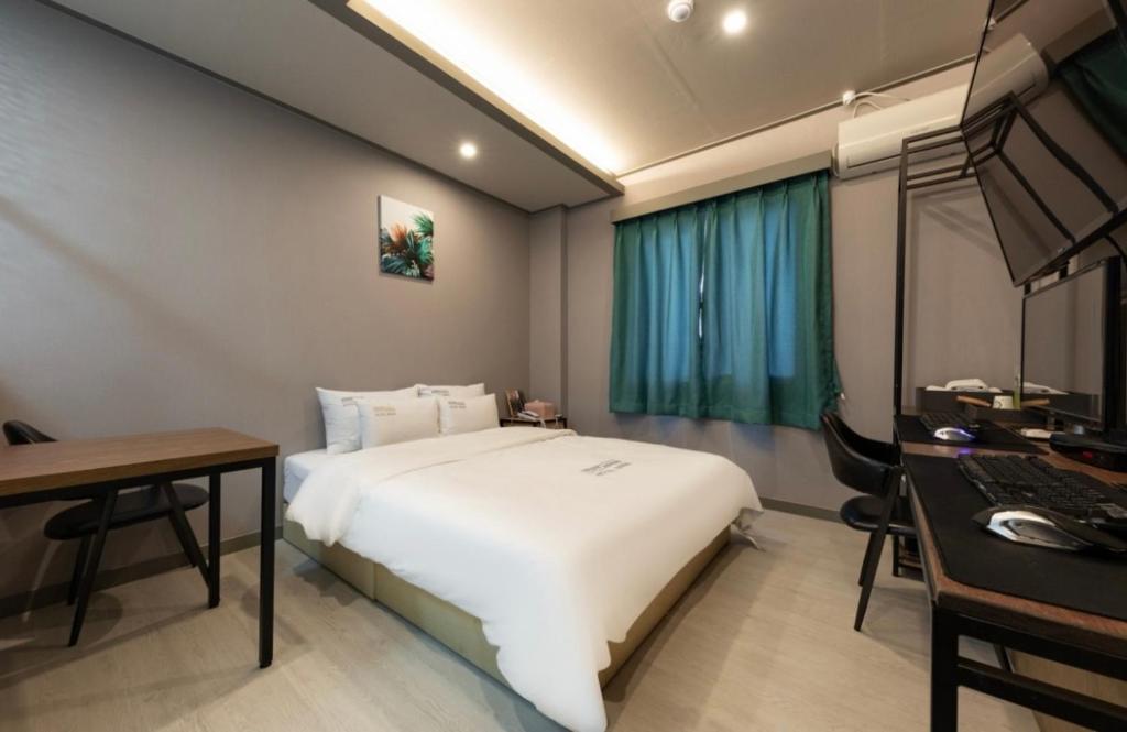 Postel nebo postele na pokoji v ubytování Hotel Band