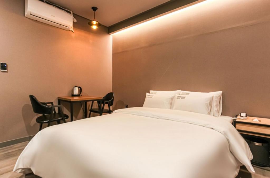 Postel nebo postele na pokoji v ubytování Hotel Band