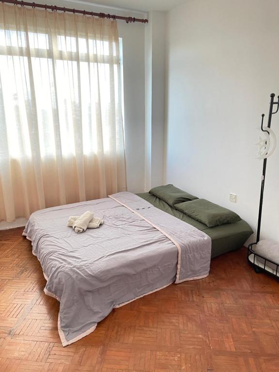 Postel nebo postele na pokoji v ubytování Anna温馨公寓式的住宅