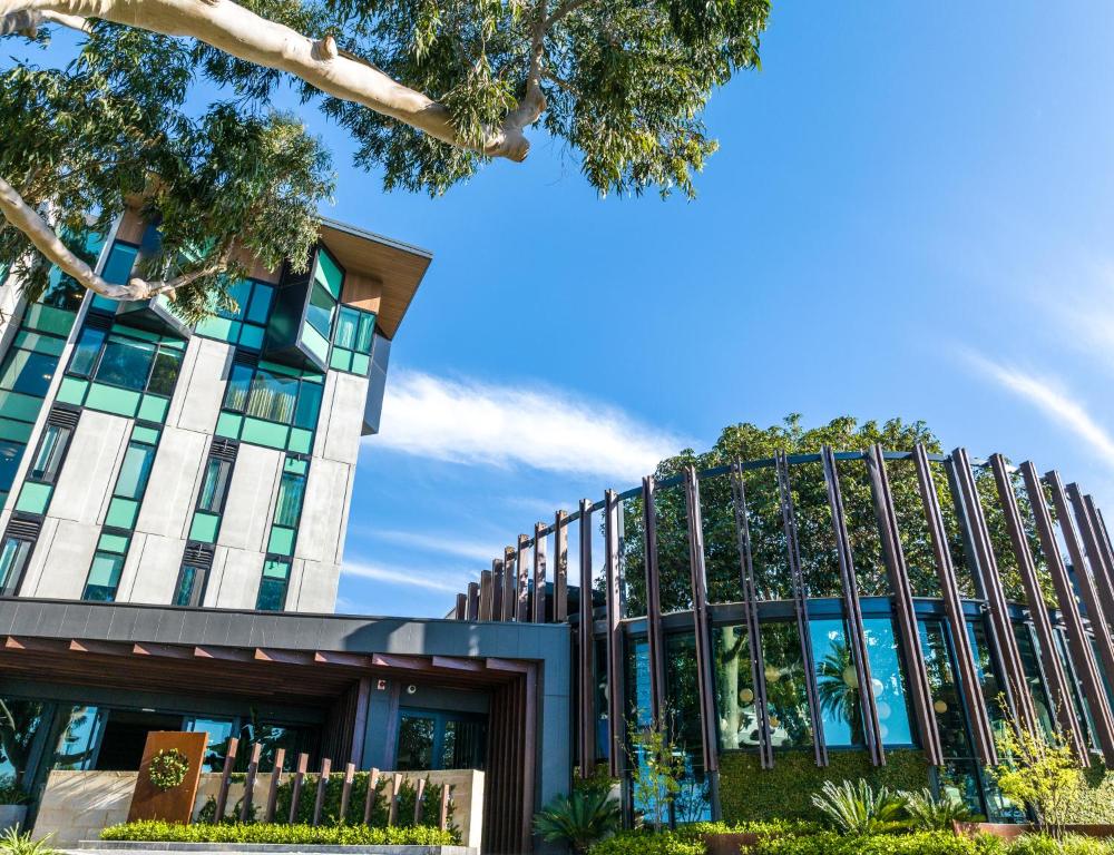 a building with a fence in front of it at Marion Hotel in Adelaide