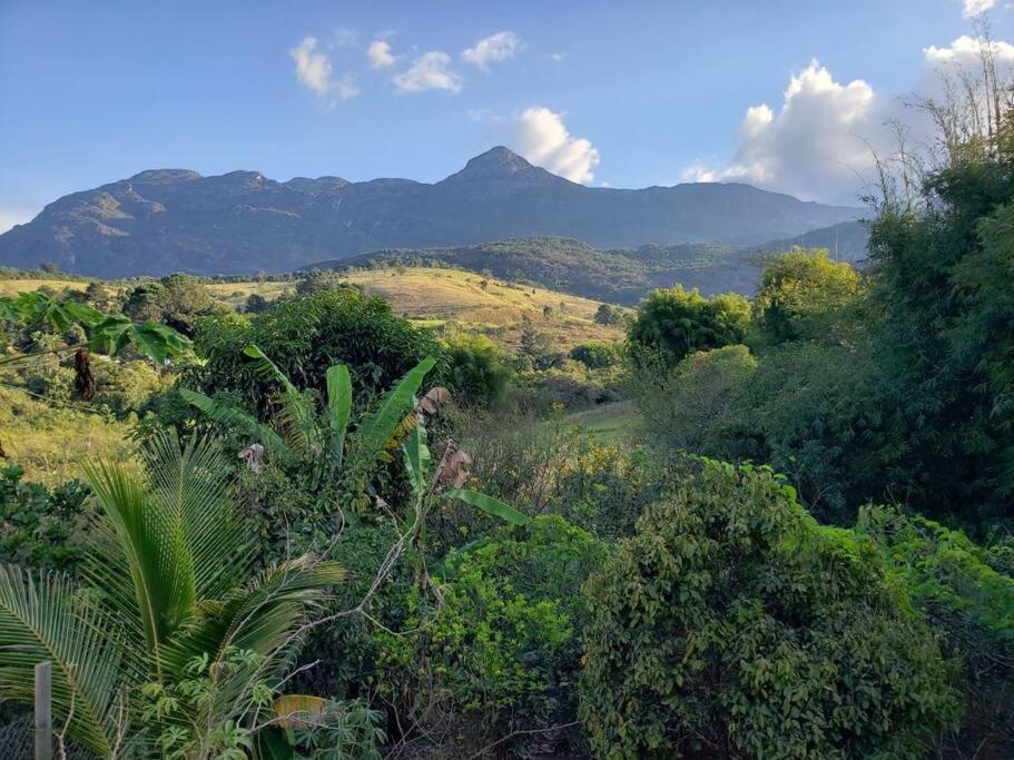 a view of a forest with mountains in the background at Casa Especial em Catas Altas in Catas Altas