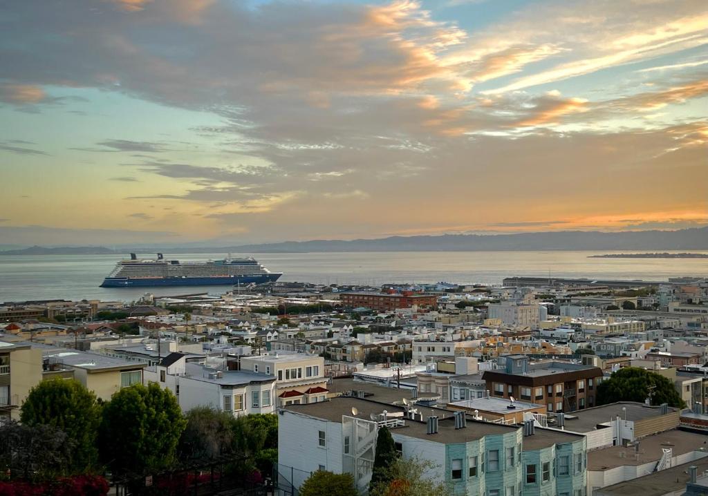 a cruise ship in the water with a city at Great bay views in Russian Hill district in San Francisco