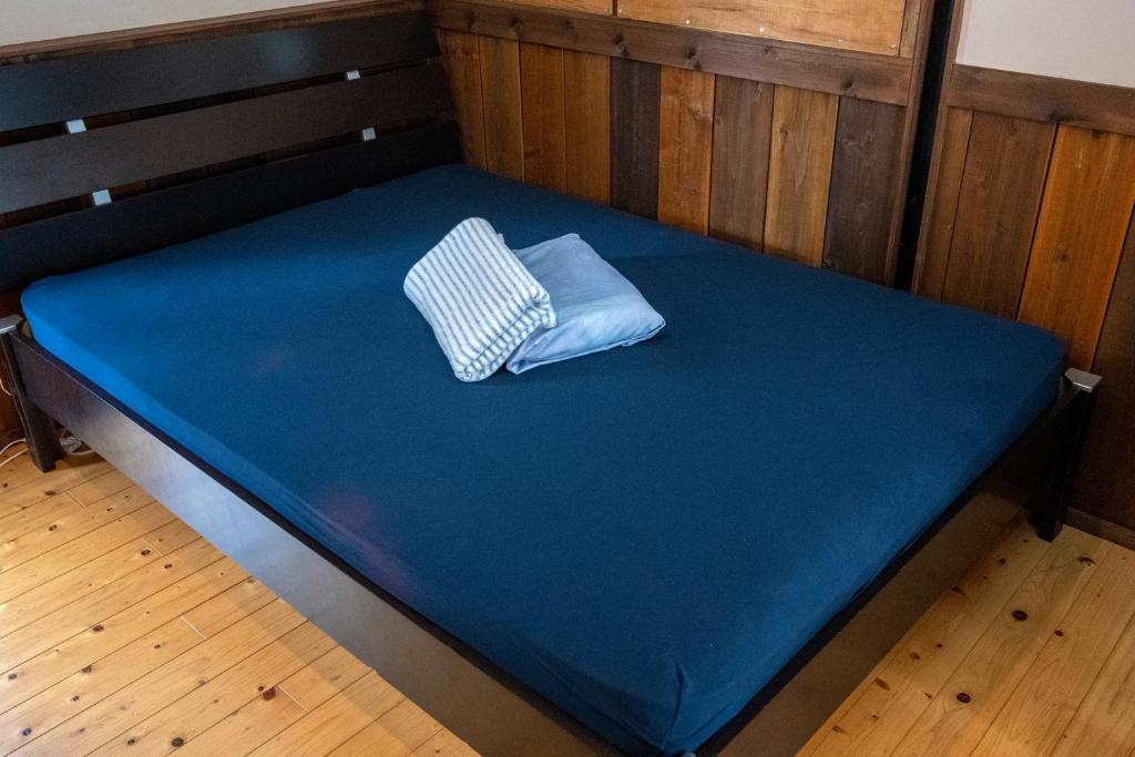 Letto o letti in una camera di Haryugetu Guesthouse in NASA