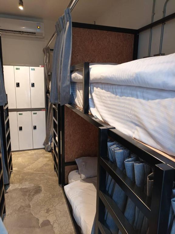 Postel nebo postele na pokoji v ubytování 薇薇青旅-嚞驫驛站