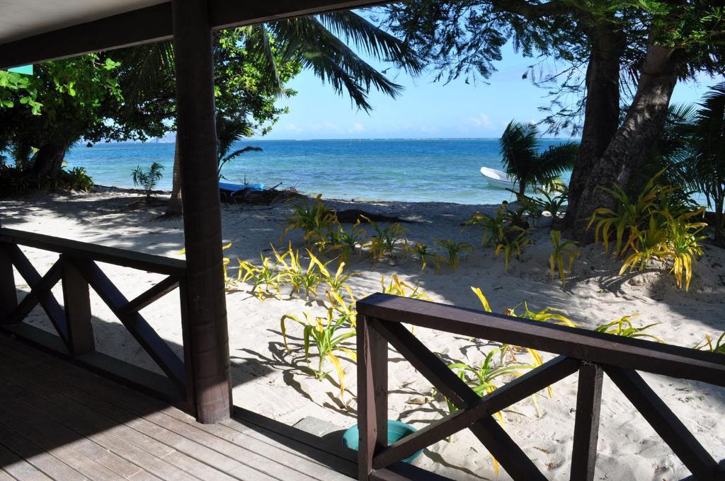 a view of the beach from the porch of a house at Mana Backpackers and Dive Resort in Mana Island