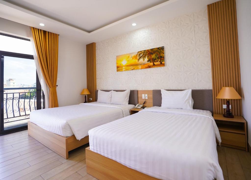 Postel nebo postele na pokoji v ubytování An Dương Hotel & Apartment