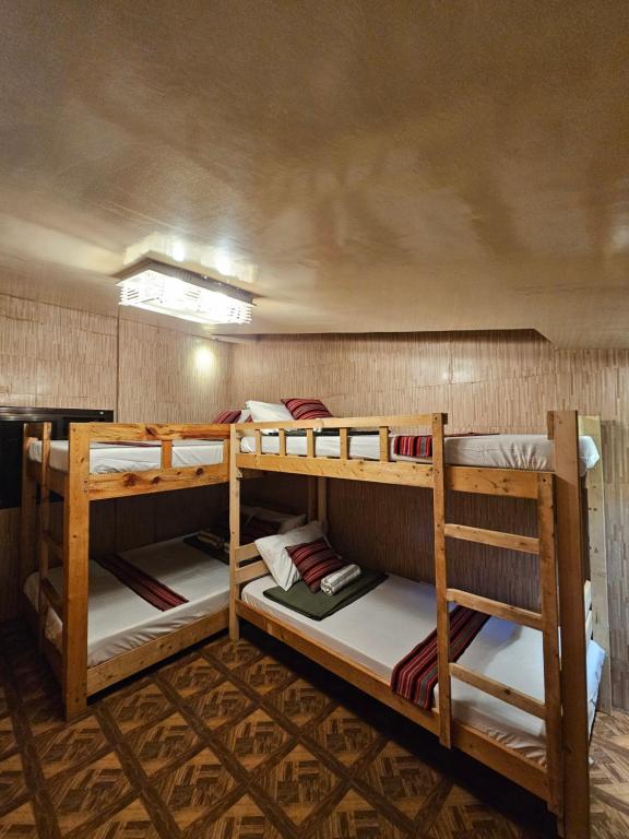 a group of bunk beds in a room at The Gather Inn Room Rentals - Baguio City in Baguio
