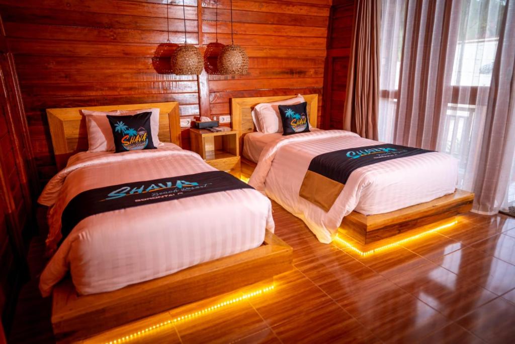 Tempat tidur dalam kamar di Shava Beach Resort