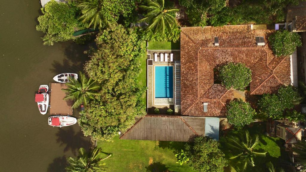 an aerial view of a house with a swimming pool at Villa Apsara by Avant Garde in Aluthgama