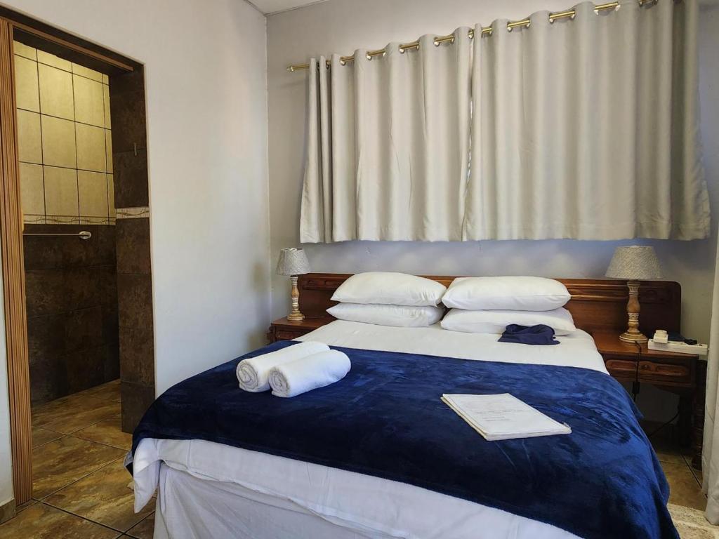 Postel nebo postele na pokoji v ubytování Agros Guest House