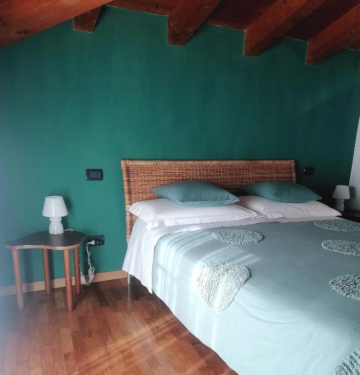 Postel nebo postele na pokoji v ubytování Quadrisfera Apartment