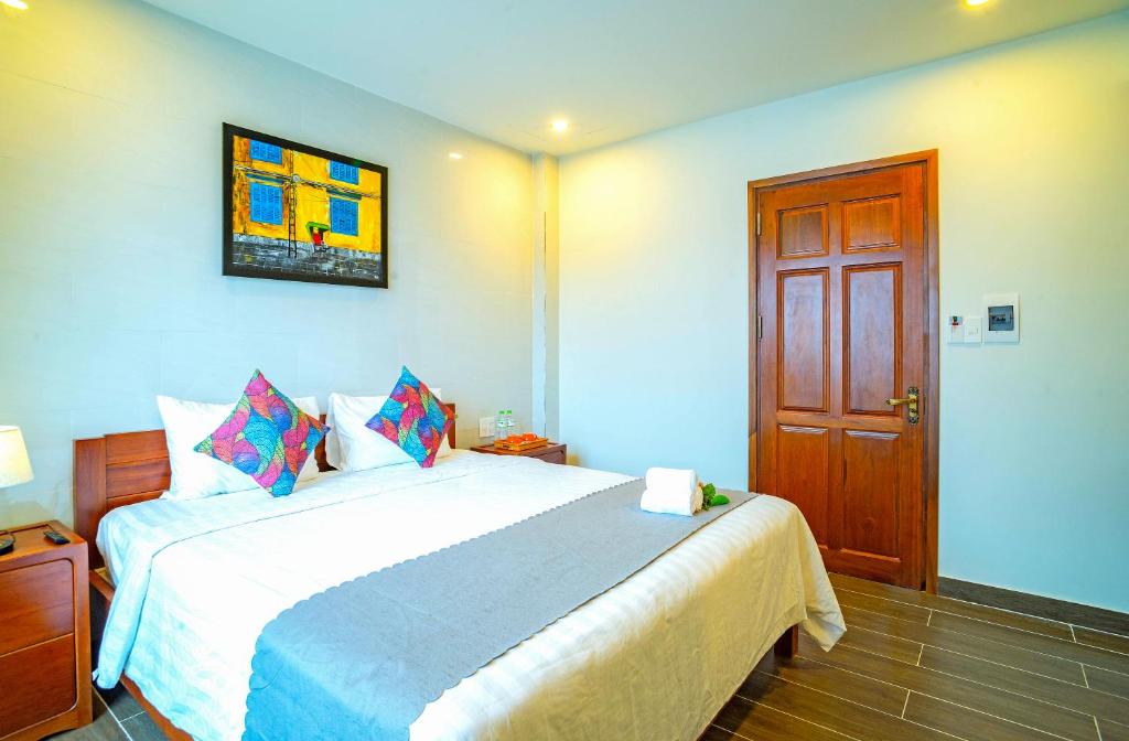 Postel nebo postele na pokoji v ubytování Phuoc Dat Riverside Homestay Hoi An